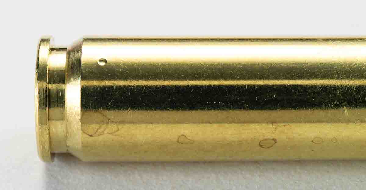 The steel ball penetrator has pressed into the case of a .308 Winchester.